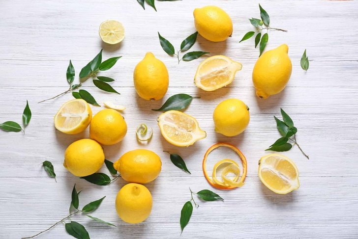 Pile of lemons on wooden table