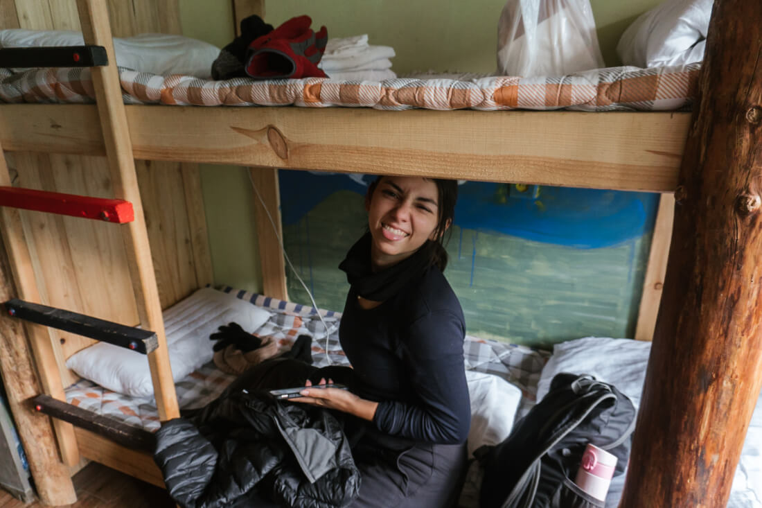 Stacey Valle sitting on the bottom bunk of a bunk bed sticking her tongue out at the camera