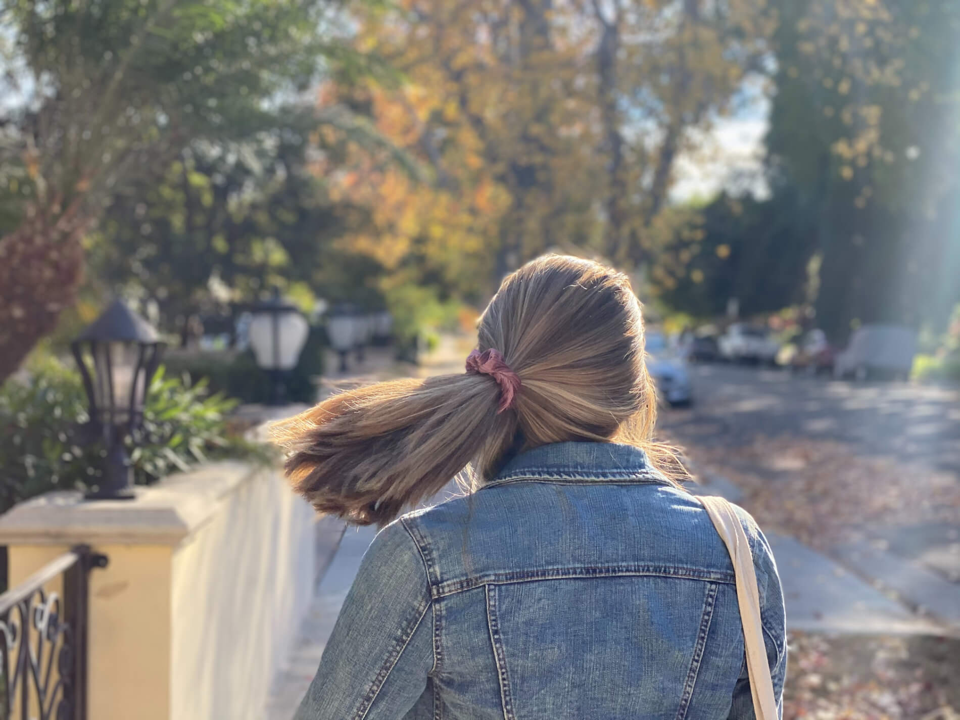 Marika Price walking away down a sidewalk