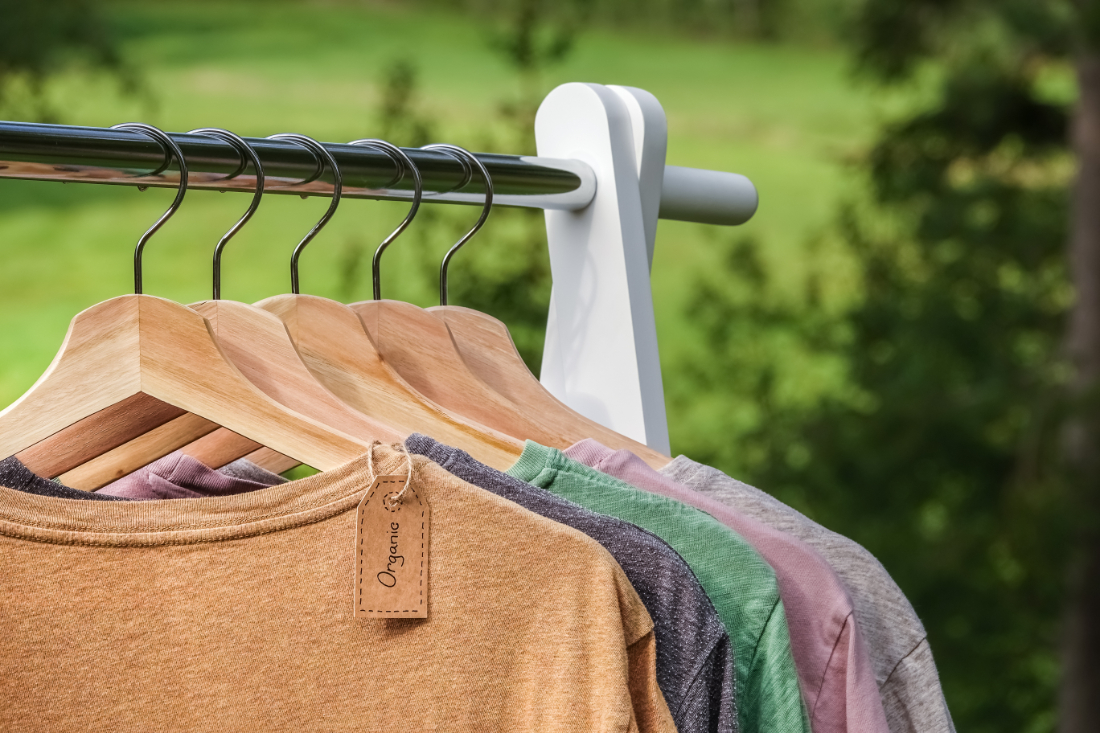 Shirts on hangers with an organic tag