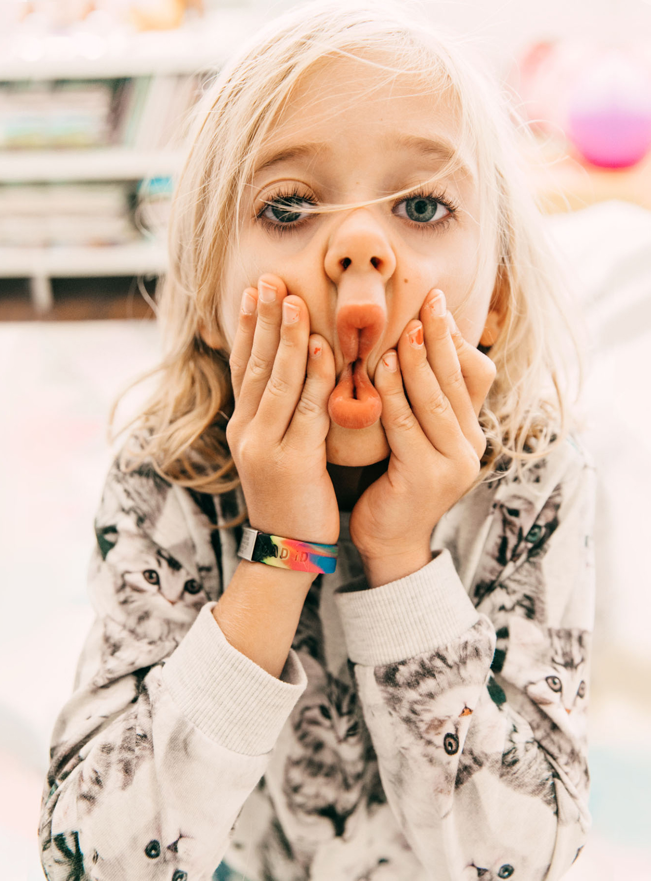 little girl squishing lips together